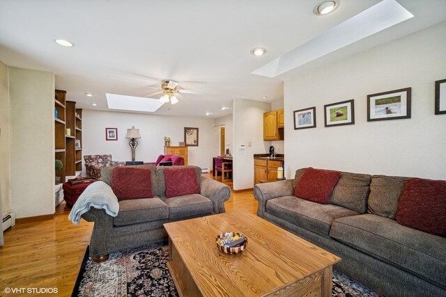 1704 Executive Ln, Glenview, IL 60026 - living area featuring a skylight, a ceiling fan, light wood-style flooring, and recessed lighting