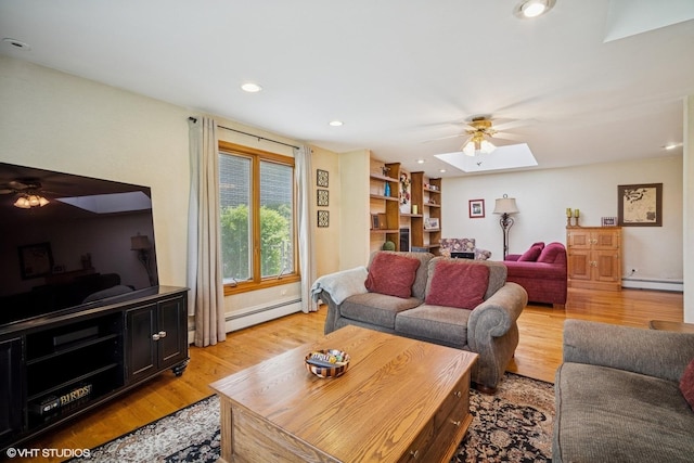 1704 Executive Ln, Glenview, IL 60026 - living area featuring a ceiling fan, baseboard heating, a baseboard radiator, a skylight, and light wood-style flooring
