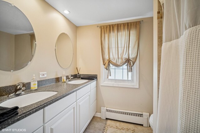 1704 Executive Ln, Glenview, IL 60026 - full bathroom featuring baseboard heating, baseboards, toilet, double vanity, and tile patterned floors