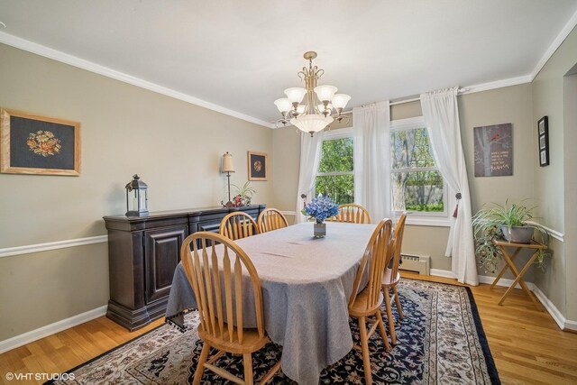 1704 Executive Ln, Glenview, IL 60026 - dining room with a chandelier, light wood-style flooring, baseboards, ornamental molding, and baseboard heating