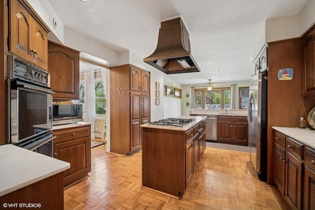 1704 Executive Ln, Glenview, IL 60026 - kitchen featuring island range hood, appliances with stainless steel finishes, plenty of natural light, and a kitchen island