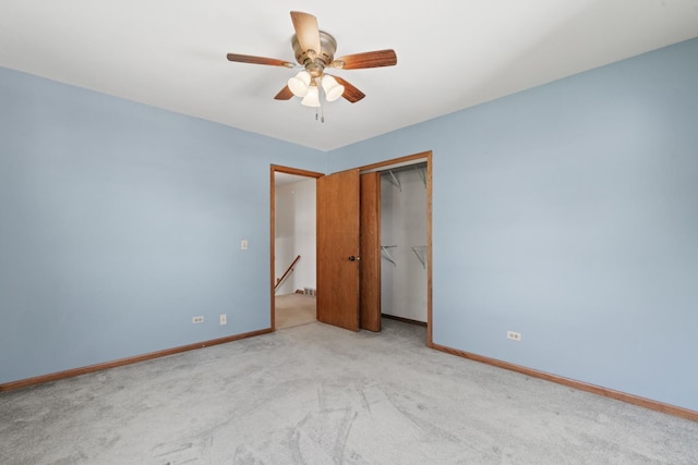 unfurnished bedroom with a ceiling fan, baseboards, carpet floors, and a closet