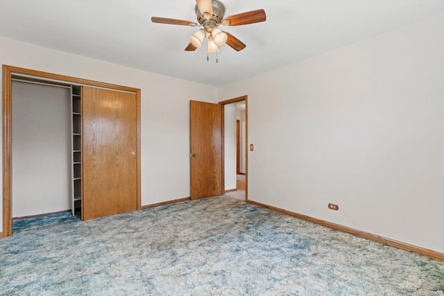 unfurnished bedroom with carpet floors, a closet, baseboards, and ceiling fan