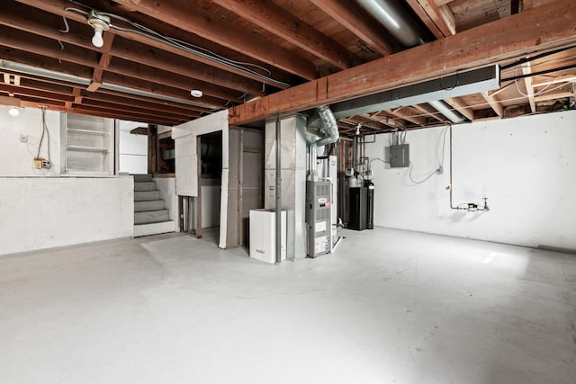 unfinished below grade area with electric panel and stairs
