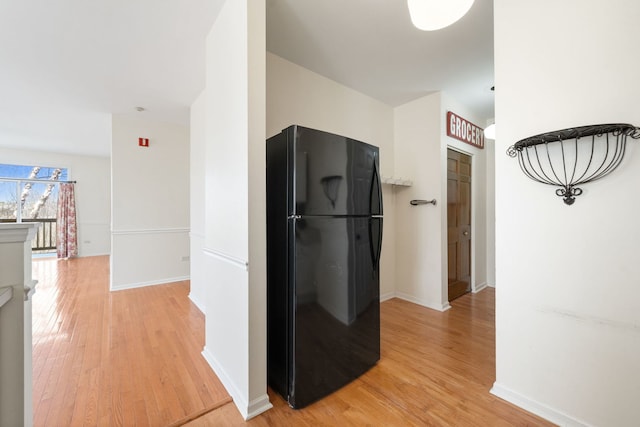 2543 Oneida Ln, Naperville, IL 60563 - kitchen with light wood-style floors, baseboards, and freestanding refrigerator