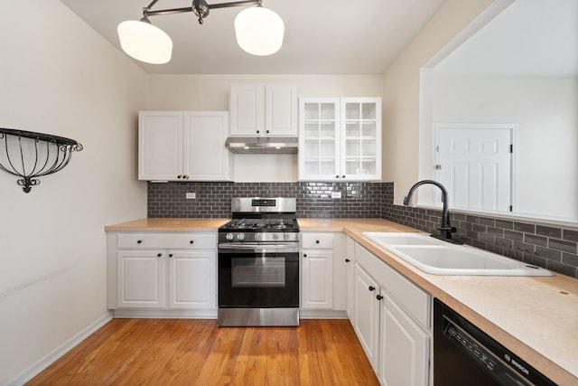 2543 Oneida Ln, Naperville, IL 60563 - kitchen with white cabinets, gas range, dishwasher, a sink, and under cabinet range hood