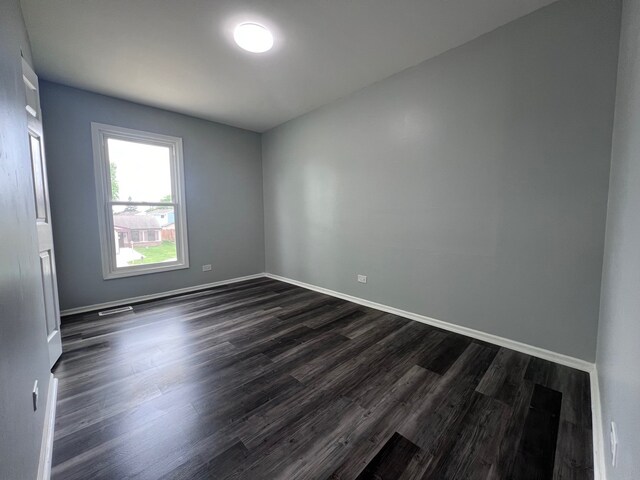 1170 Singleton Dr, Roselle, IL 60172 - empty room with dark wood-type flooring and baseboards