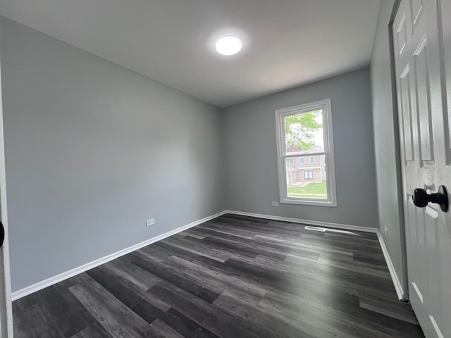 1170 Singleton Dr, Roselle, IL 60172 - spare room featuring dark wood-type flooring and baseboards