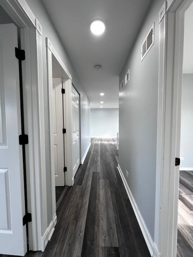 1170 Singleton Dr, Roselle, IL 60172 - hallway with dark wood-style flooring and baseboards