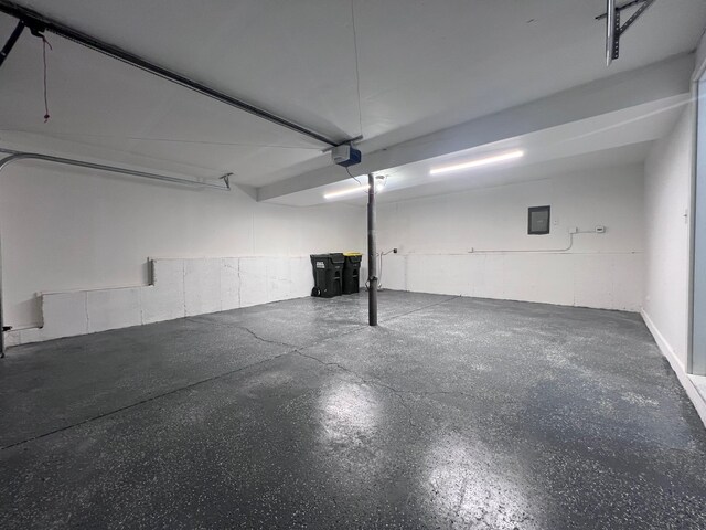 1170 Singleton Dr, Roselle, IL 60172 - garage featuring a garage door opener and electric panel