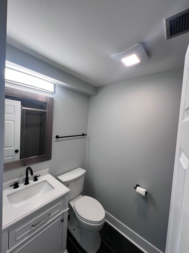 1170 Singleton Dr, Roselle, IL 60172 - bathroom featuring toilet, vanity, tile patterned floors, and a shower