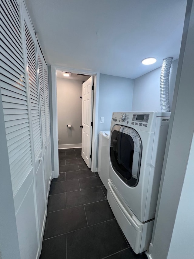 1170 Singleton Dr, Roselle, IL 60172 - laundry room with washer / clothes dryer and dark tile patterned floors