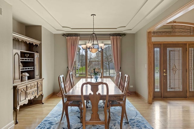 10440 Deer Chase Ave, Orland Park, IL 60467 - dining area with light wood finished floors, an inviting chandelier, and baseboards