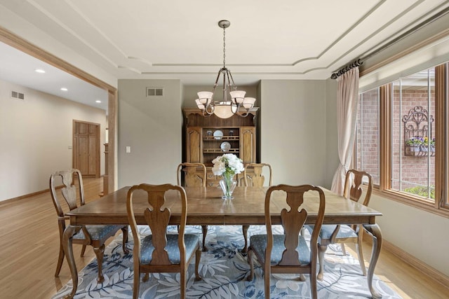 10440 Deer Chase Ave, Orland Park, IL 60467 - dining area featuring baseboards, light wood-style floors, a notable chandelier, and visible vents