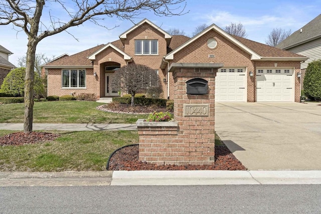 10440 Deer Chase Ave, Orland Park, IL 60467 - view of front of property featuring a garage, roof with shingles, a front yard, brick siding, and concrete driveway