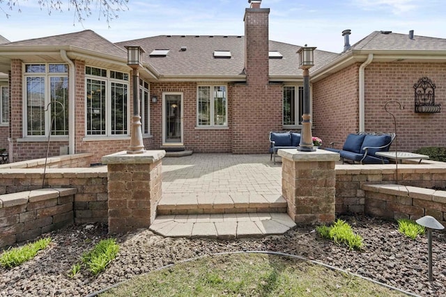 10440 Deer Chase Ave, Orland Park, IL 60467 - back of house featuring a patio area, roof with shingles, brick siding, and a chimney