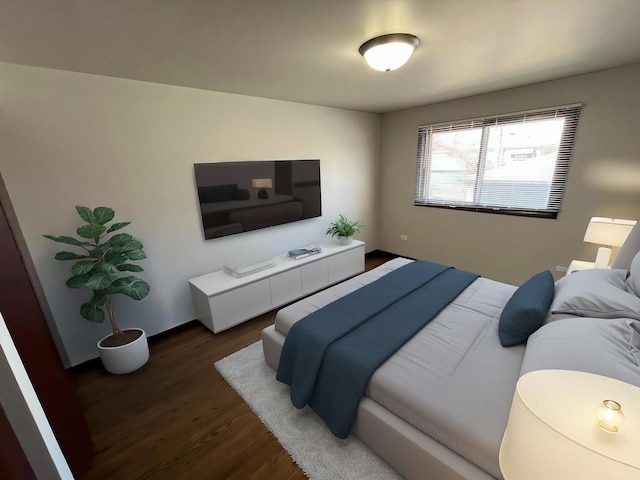 bedroom with wood finished floors