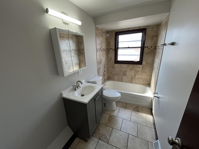 bathroom featuring vanity, tile patterned floors, toilet, and shower / tub combination