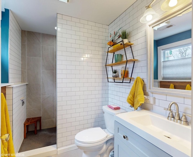 2606 Martin Dr, Spring Grove, IL 60081 - full bath with vanity, tile walls, a walk in shower, toilet, and visible vents