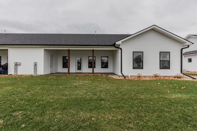 1017 S Sixth St Unit 1, Princeton, IL 61356 - view of front of property featuring a shingled roof and a front lawn