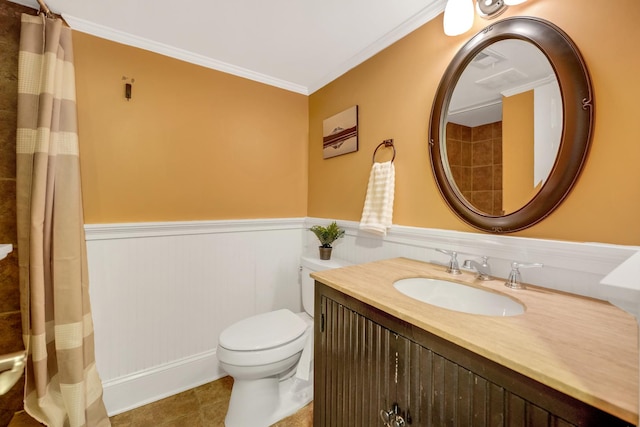 full bathroom with wainscoting, toilet, vanity, and crown molding