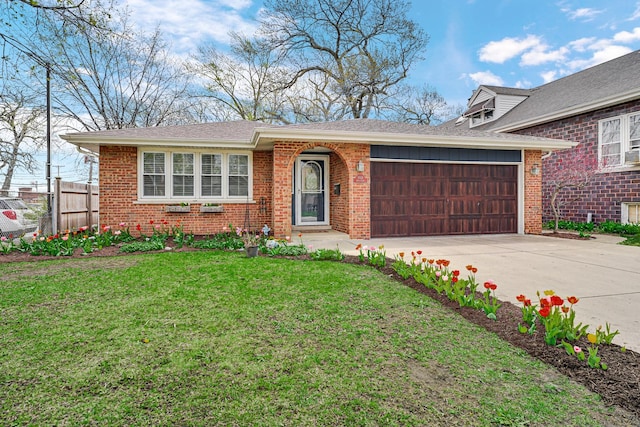 view of front of home with a front lawn, driveway, fence, a garage, and brick siding