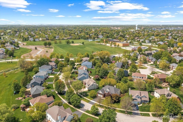 aerial perspective of suburban area featuring a large body of water