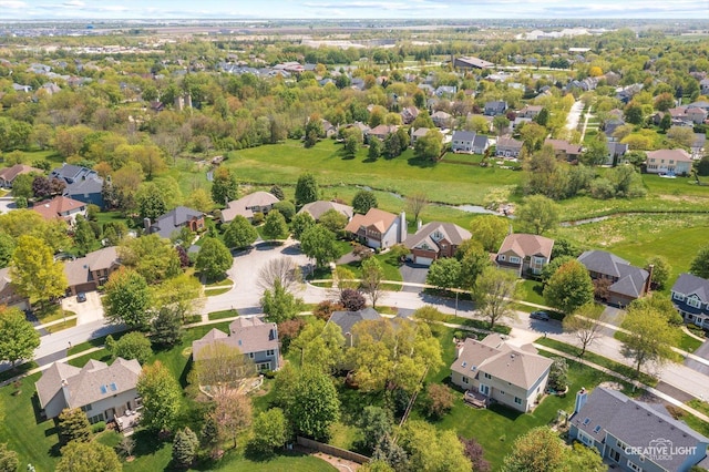 aerial view of property's location featuring nearby suburban area