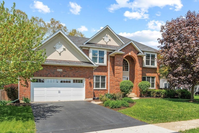 traditional-style home featuring a front lawn, driveway, brick siding, and a garage