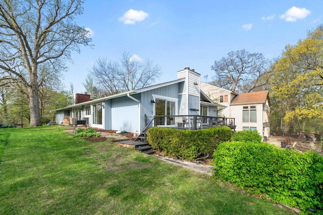 209 Oak Cv, Lake Holiday, IL 60552 - rear view of property with a wooden deck, a yard, and a chimney