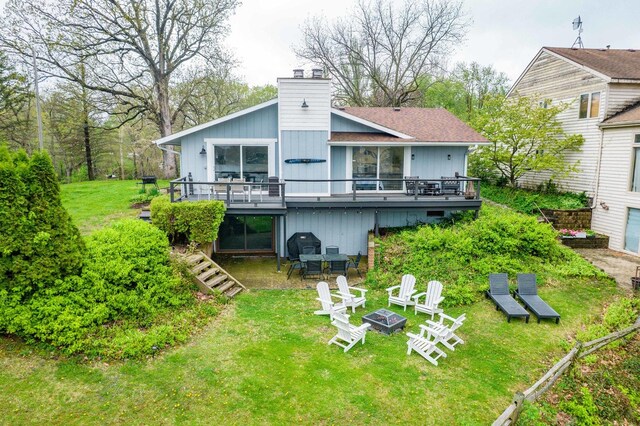 209 Oak Cv, Lake Holiday, IL 60552 - back of house featuring a lawn, a fire pit, a wooden deck, and a chimney