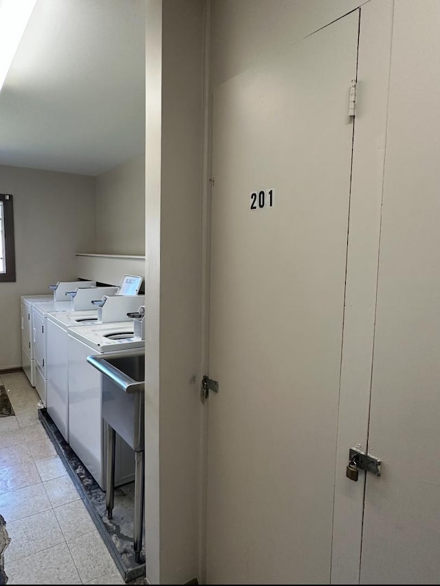 4425 Blackhawk Ln Unit 201, Lisle, IL 60532 - laundry area with independent washer and dryer and a sink
