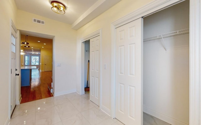 interior space with visible vents, baseboards, and light tile patterned flooring