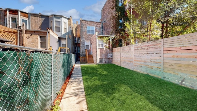 view of yard with a fenced backyard
