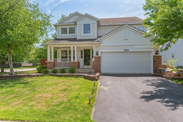 2704 Flagstone Cir, Naperville, IL 60564 - view of front of house with aphalt driveway, brick siding, and a front lawn