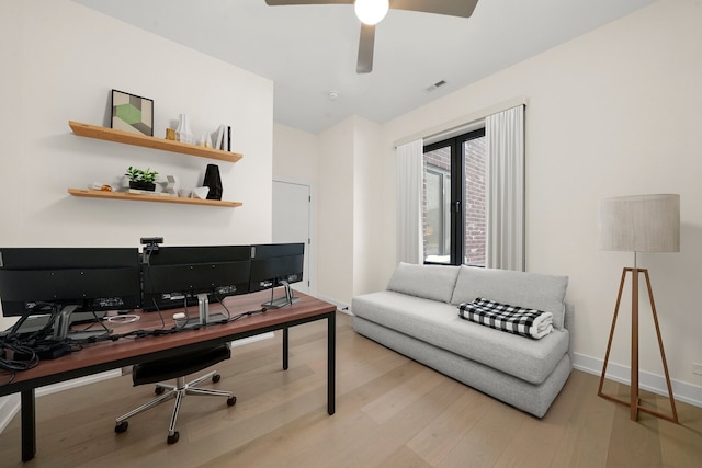 office area featuring visible vents, ceiling fan, wood finished floors, and baseboards