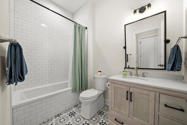 full bath with tiled shower / bath combo, toilet, vanity, and tile patterned floors