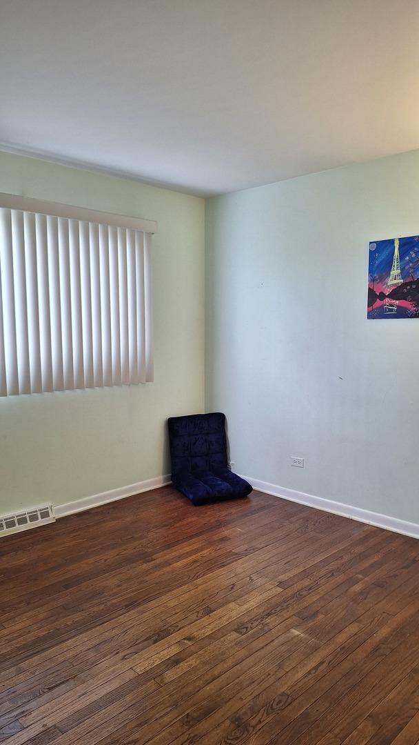 1344 Jeffery Dr, Homewood, IL 60430 - spare room featuring visible vents, baseboards, and wood finished floors