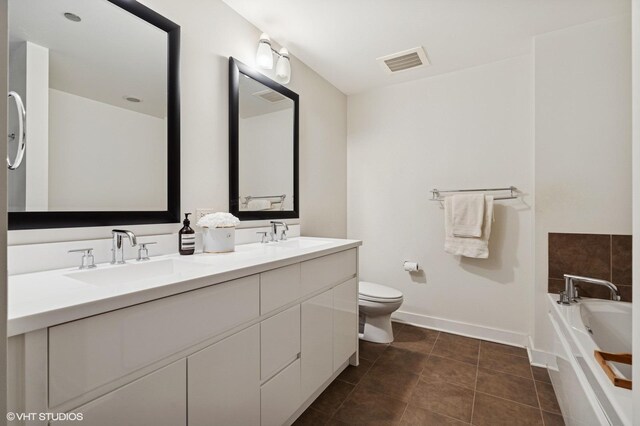 505 N Mcclurg Ct Unit 1801, Chicago, IL 60611 - bathroom featuring double vanity, baseboards, toilet, a garden tub, and tile patterned flooring