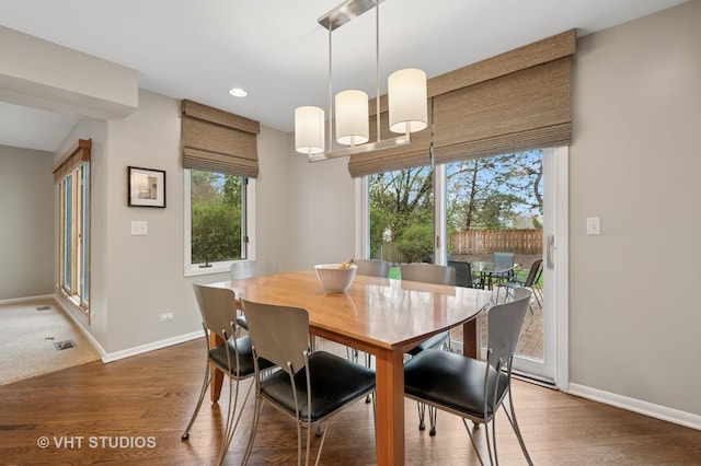 dining area featuring baseboards, recessed lighting, and wood finished floors