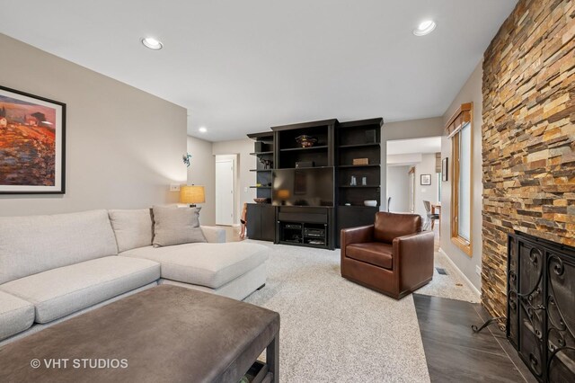 living room with recessed lighting and dark wood finished floors
