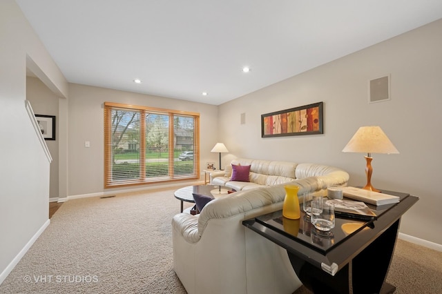 living area featuring baseboards, recessed lighting, and carpet