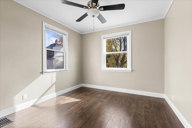 206 Franklin Pl, Rockford, IL 61103 - empty room with dark wood-style flooring, baseboards, crown molding, and a ceiling fan