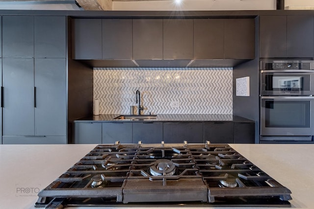 1070 W 15th St Unit 302, Chicago, IL 60608 - kitchen with a sink, decorative backsplash, gas cooktop, and light countertops