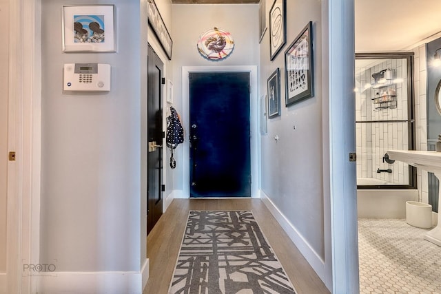 1070 W 15th St Unit 302, Chicago, IL 60608 - entryway featuring baseboards and wood finished floors