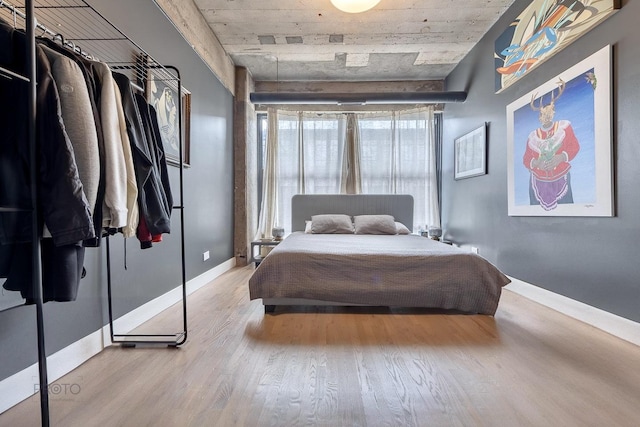 1070 W 15th St Unit 302, Chicago, IL 60608 - bedroom featuring wood finished floors and baseboards