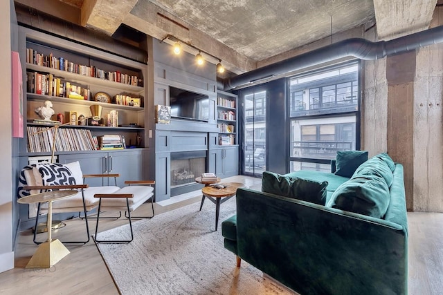 1070 W 15th St Unit 302, Chicago, IL 60608 - living area with wood finished floors, a large fireplace, and built in shelves