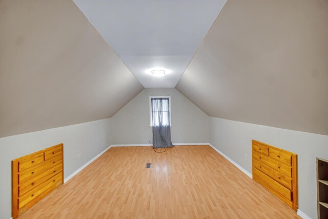 basement with wooden walls and a drop ceiling