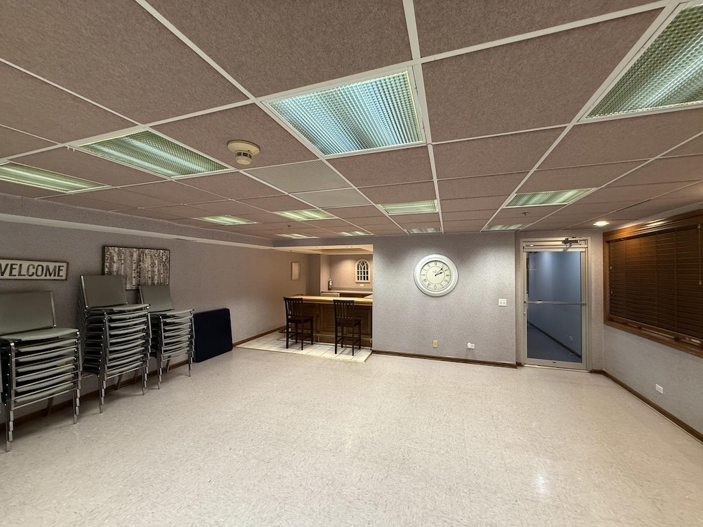 7120 N Milwaukee Ave Unit 305, Niles, IL 60714 - finished below grade area with a community bar and a drop ceiling