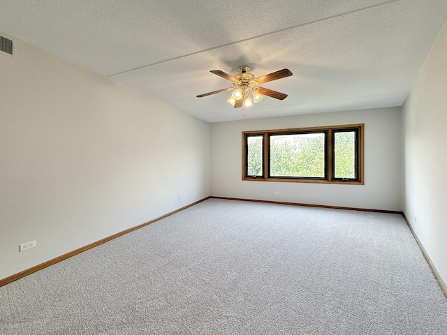 7120 N Milwaukee Ave Unit 305, Niles, IL 60714 - empty room featuring light carpet, ceiling fan, and a textured ceiling